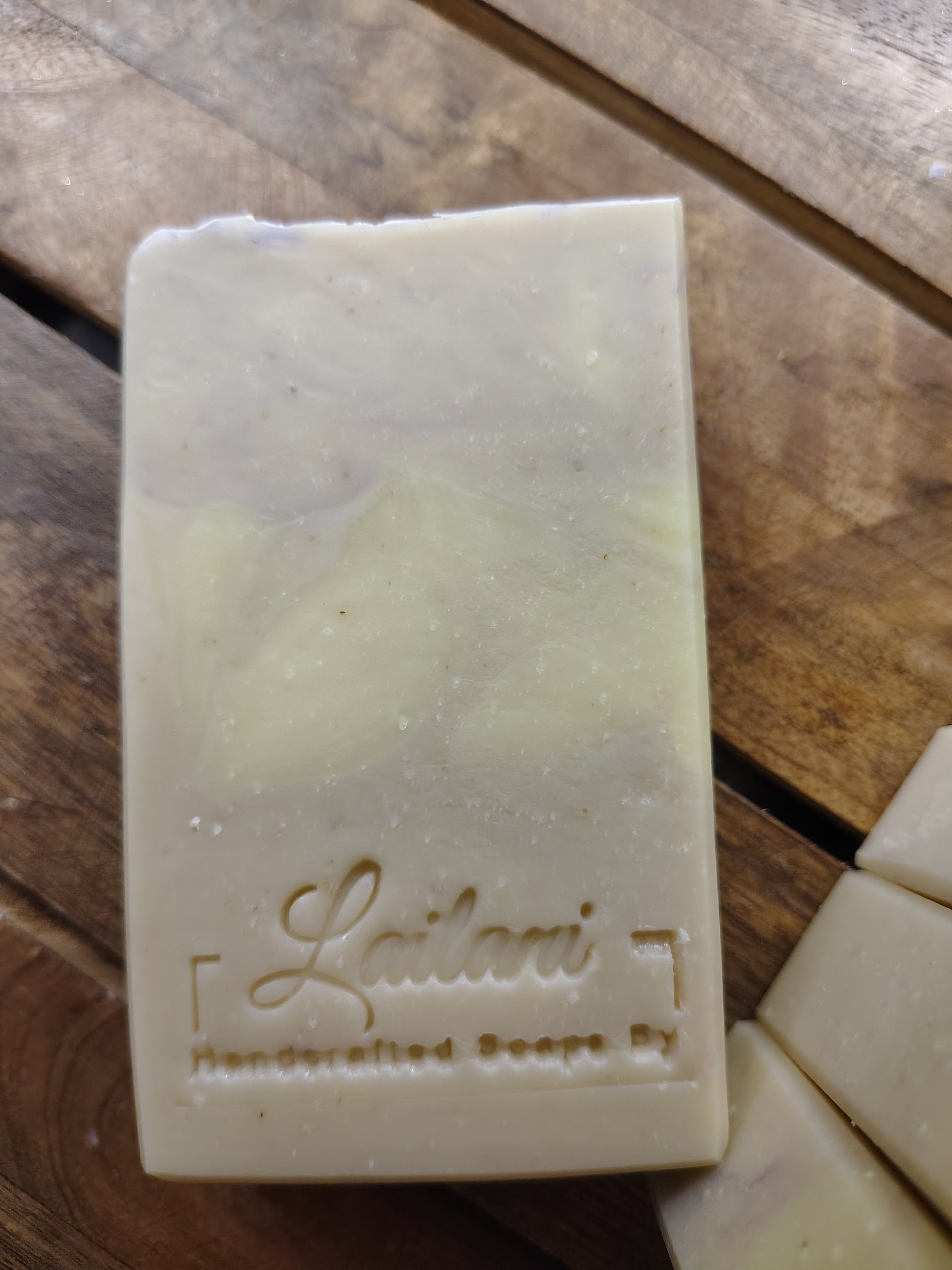 Bar of soap with 'Lailani' branding on a wooden surface